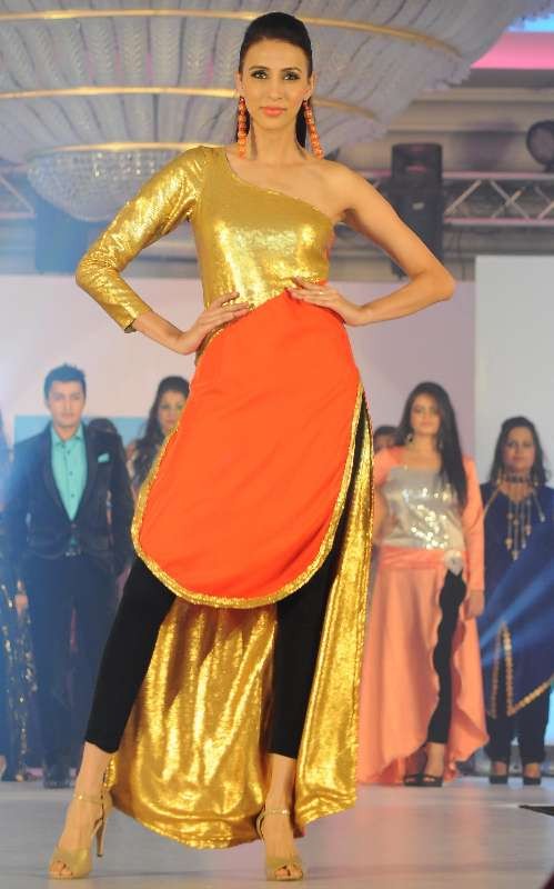 Mumbai: Model Alesia Raut displays the creation by the students of IITC Institute Global Careers during their annual fashion show organized in Mumbai, on Dec. 22, 2014. (Photo: IANS)