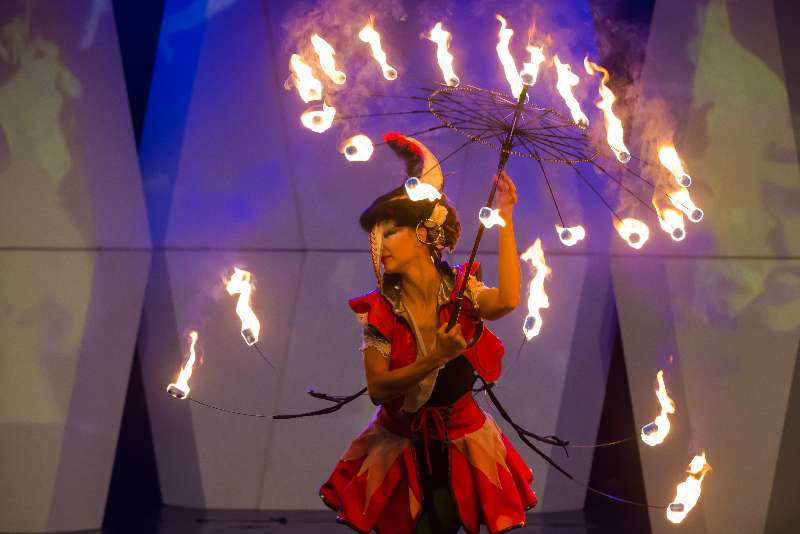 A fire juggler from the Magma Fire Theatre of Hungary performs during the Budapest Fashion Week held in Budapest, Hungary