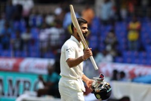 Indian captain Virat Kohli raises his bat to acknowledge the applause from the crowd as he leaves the ground after getting dismissed on the second day of the only test match between India and Bangladesh in Hyderabad (Photo: Surjeet Yadav/IANS)