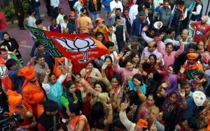 BJP supporters celebrate as assembly election results being announced at BJP office in New DelhI (Photo: IANS)
