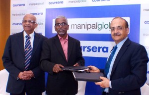 Bengaluru: Manipal Global Managing Director and CEO S Vaitheeswara and Courser's Chief Business Officer Nikhil Sinha exchange greetings after signing the partnership between Manipal Global and Coursera in Bengaluru, on Sept 27, 2016. Also seen Manipal University Vice-Chancellor Dr. Vinod Bhat. (Photo: IANS)