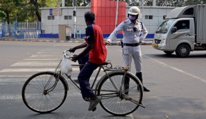 Kolkata: Police personnel intercept violaters during a complete lockdown for 21 days announced by Prime Minister Narendra Modi to prevent further spreading of the COVID 19 pandemic in India; in Kolkata on March 25, 2020. (Photo: Kuntal Chakrabarty/IANS)