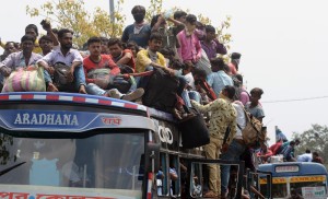 Kolkata: An overcrowded bus with migrant workers returning back home amid COVID-19 outbreak, seen during complete lockdown in the country in a bid to curtail the spread of coronavirus, in Kolkata on March 23, 2020. (Photo: Kuntal Chakrabarty/IANS)
