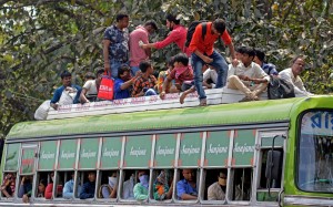 Kolkata: An overcrowded bus with migrant workers returning back home amid COVID-19 outbreak, seen during complete lockdown in the country in a bid to curtail the spread of coronavirus, in Kolkata on March 23, 2020. (Photo: Kuntal Chakrabarty/IANS)