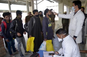 Baramulla: Passengers being screened for COVID-19 at Baramulla railway station amid coronavirus pandemic, in Jammu and Kashmir's Baramulla on March 18, 2020. (Photo: IANS)