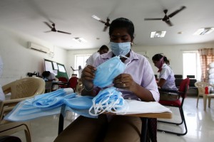 Chennai: A unit member of the police team busy manufacturing masks for police personnel amid COVID-19 pandemic during the 21-day nationwide lockdown (that entered the 8th day) imposed as a precautionary measure to contain the spread of COVID-19 (coronavirus), in Chennai on Apr 1, 2020. (Photo: IANS)