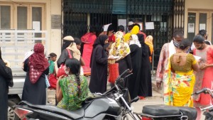 Hyderabad: Women not practising social distancing as they queue up outside a SBI Bank during the 21-day nationwide lockdown imposed as a precautionary measure to contain the spread of coronavirus, in Hyderabad on April 4, 2020. (Photo: IANS)