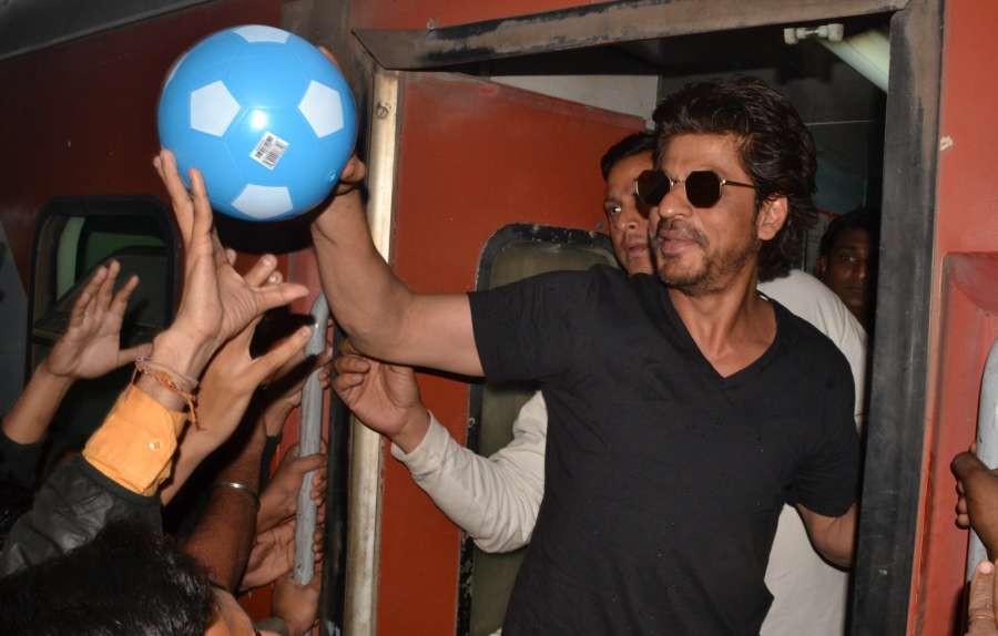 Mathura: Actor Shah Rukh Khan greets his fans at Mathura railway station while travelling by train to Delhi for promotion of his upcoming film Raees on Jan. 24, 2017. (Photo: IANS) by . 
