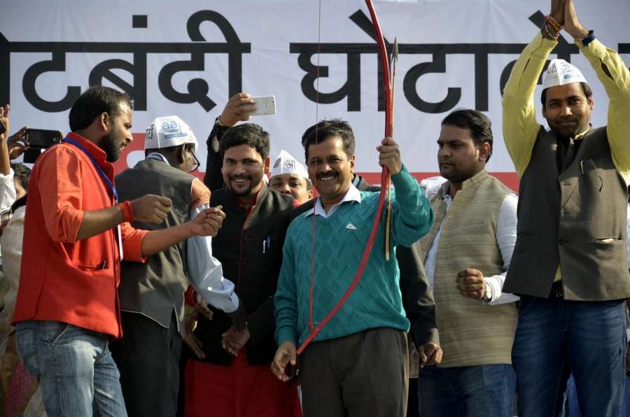 Delhi Chief Minister and AAP leader Arvind Kejriwal holds a bow and an arrow during a party rally in Ranchi on Dec 22, 2016. (Photo: IANS)