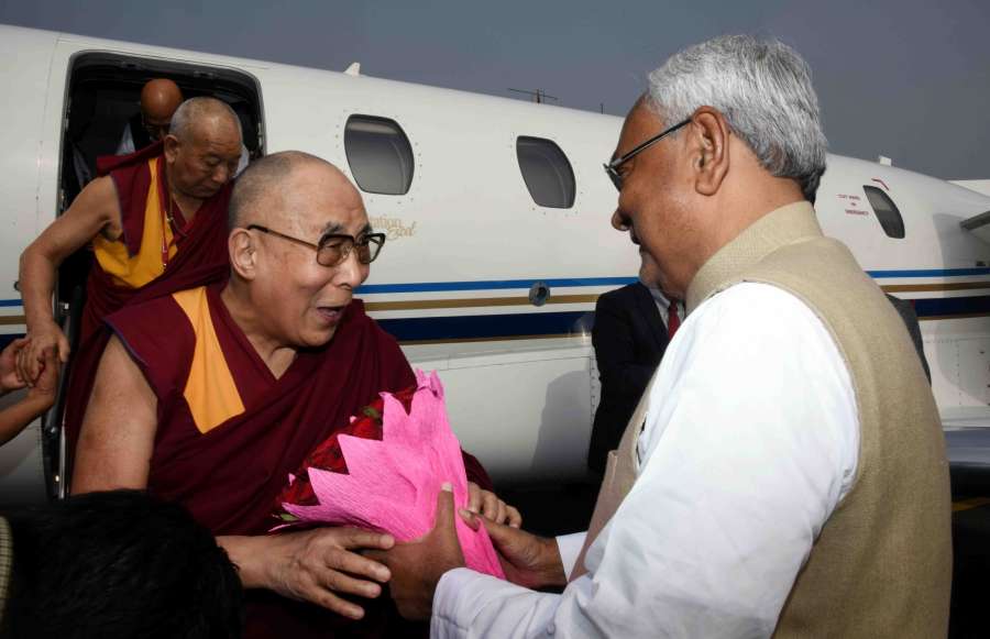 Patna: Bihar Chief Minister Nitish Kumar welcomes Tibetan spiritual leader the Dalai Lama at Jayaprakash Narayan International Airport in Patna on Dec 28, 2016. (Photo: IANS)