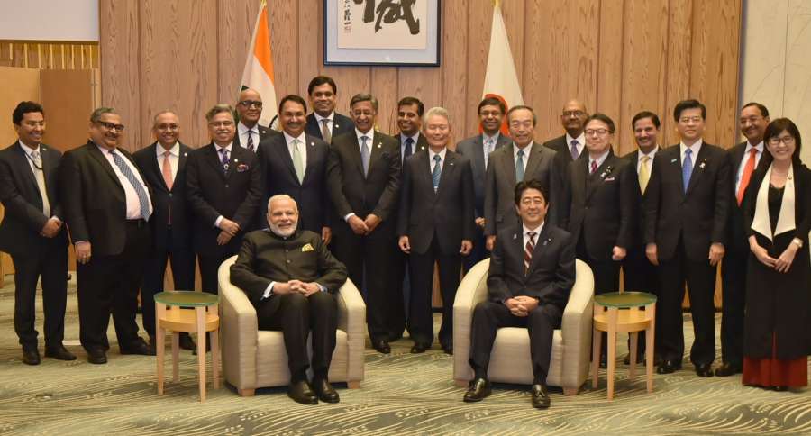 Tokyo: Prime Minister Narendra Modi and Japan's Prime Minister Shinzo Abe with the members of India-Japan Business Leaders' Forum in Tokyo, Japan on Nov 11, 2016. (Photo: IANS/PIB)