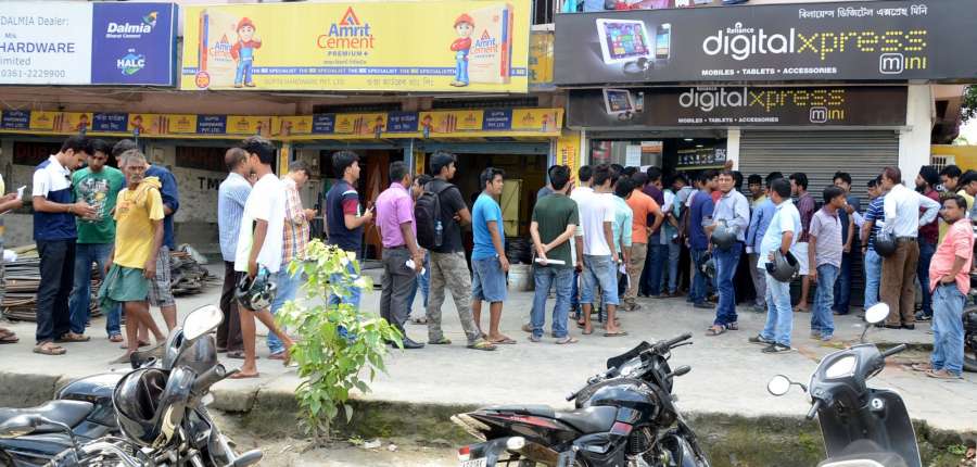 Guwahati: People queue-up outside a store to buy Reliance Jio SIM cards in Guwahati on Sept 5, 2016. (Photo: IANS)