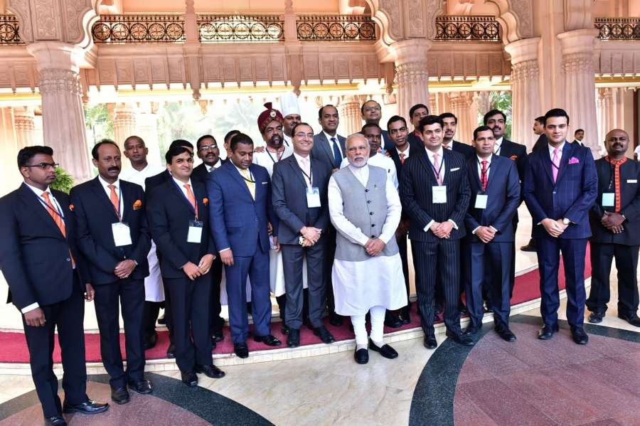 Bengaluru: Prime Minister Narendra Modi poses with the staff of Leela Palace in Bengaluru on Jan 8, 2017. (Photo: IANS)