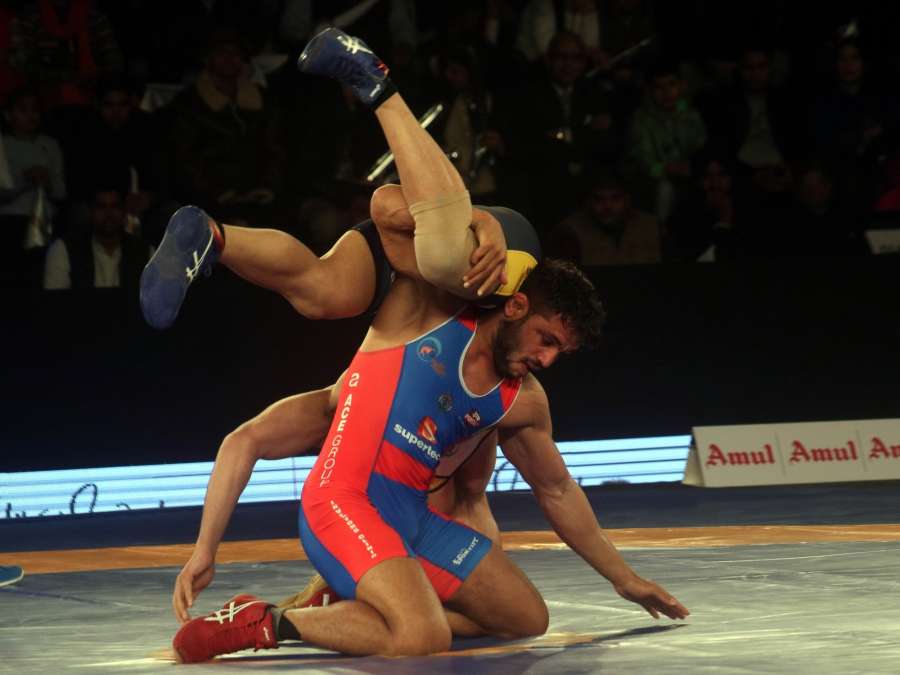 New Delhi: Amit Dhankar (in Blue) of UP Dangal and Pritam (in Yellow) of Mumbai Maharathi in action during a Pro Wrestling League (PWL) 2017 match in New Delhi, on Jan 7, 2017. (Photo: IANS)