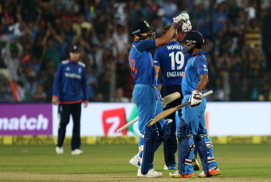 Pune: Kedar Jadhav of India celebrates his century with Virat Kohli during the 1st ODI match between India and England at the Maharashtra Cricket Association Stadium in Pune on Jan 15, 2017. (Photo: Surjeet Yadav/IANS)