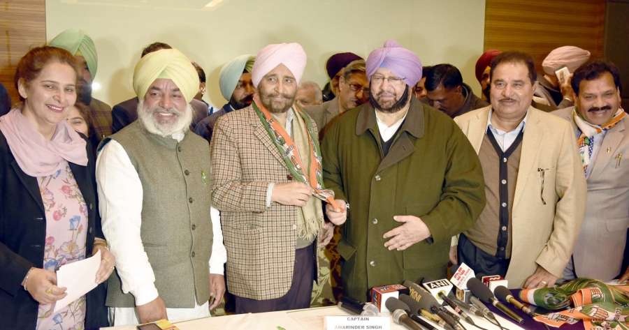 Amritsar: Punjab Congress chief Captain Amrinder Singh addresses a press conference after AAP leader Daljit Singh joined the party in Amritsar, on Jan 14, 2017. Also (Photo: IANS)