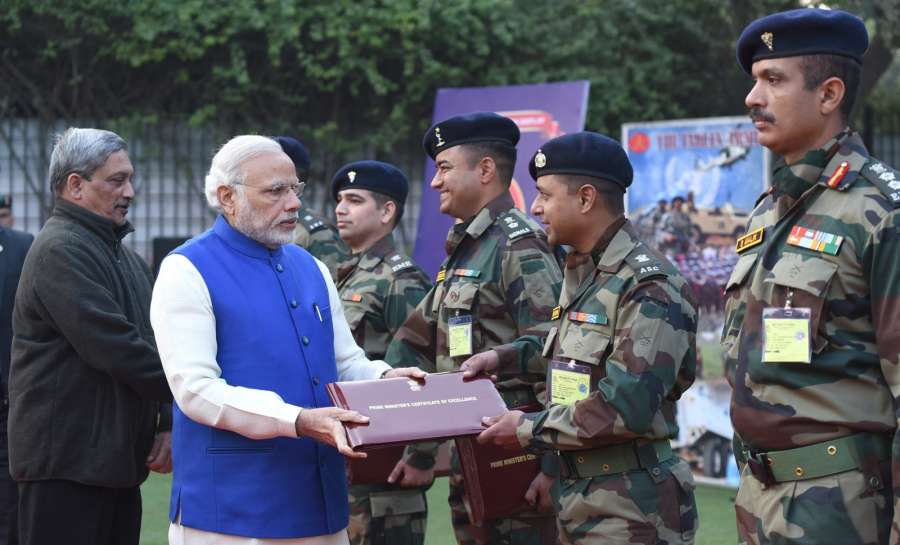 New Delhi: Prime Minister Narendra Modi presents certificates to innovators in the Indian Army, on Army Day, in NewDelhi on Jan 15, 2017. Also seenn Union Defence Minister Manohar Parrikar. (Photo: IANS/PIB) by . 