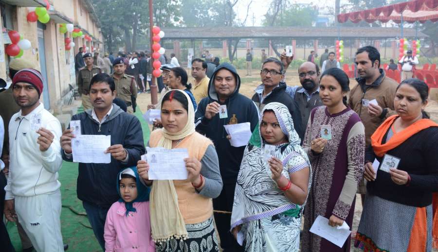 Lucknow: People queue up to cast their votes during the third phase of Uttar Pradesh Assembly polls in Lucknow on Feb 19, 2017. (Photo: IANS) by . 