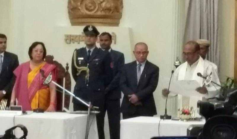 Imphal: Manipur Governor Najma Heptulla hands over the invitation letter to BJP leader Nongthombam Biren Singh to form the Goverment of Manipur at Raj Bhavan in Imphal on March 15, 2017. (Photo: IANS) by .