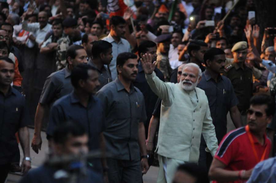 Prime Minister Narendra Modi greeting supporters during a road show at BJP party office in New Delhi on March 12, 2017. (Photo: IANS) by .