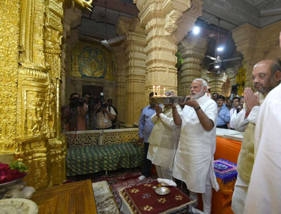 Ahmedabad: Saurashtra: Prime Minister Narendra Modi pays obeisance at Somnath temple in Prabhas Patan near Veraval in Saurashtra, Gujarat on March 8, 2017. Also seen BJP chief Amit Shah. (Photo: IANS/PIB) by . 