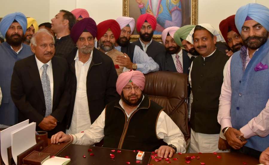 Chandigarh: Captain Amarinder Singh takes charge as the Punjab Chief Minister in Chandigarh on Feb 16, 2017. (Photo: IANS) by . 