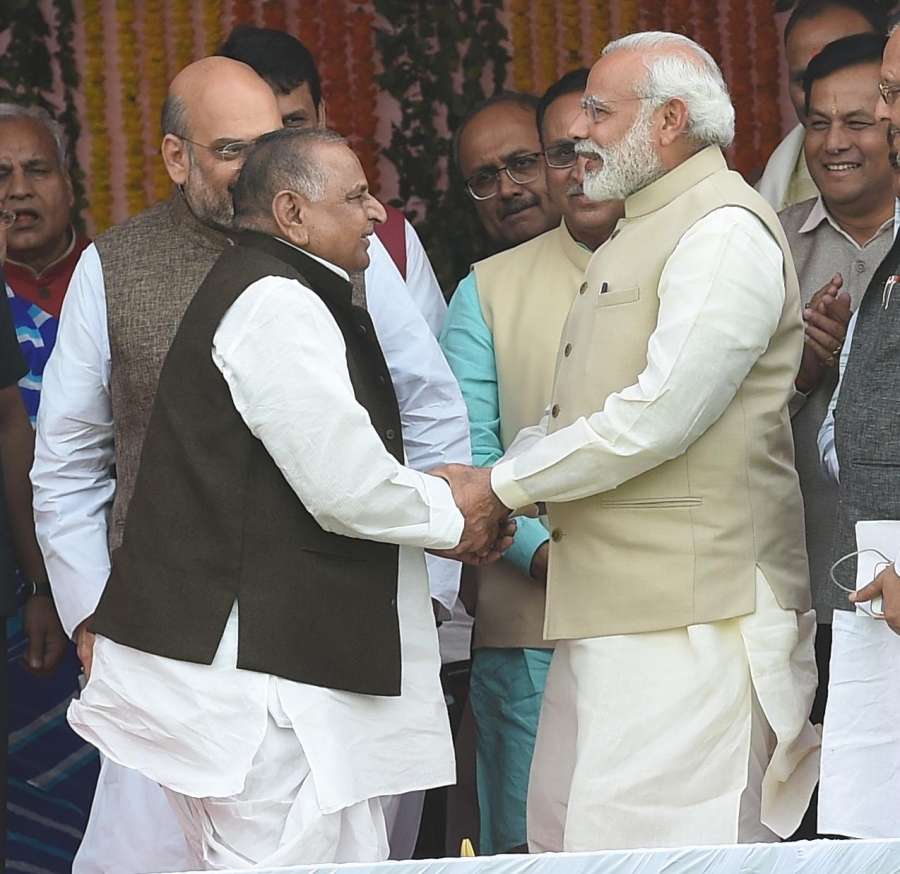 Lucknow: Prime Minister Narendra Modi greeting Samajwadi Party leader Mulayam Singh Yadav during the swearing-in ceremony of Yogi Adityanath as Uttar Pradesh Chief Minister in Lucknow on March 19, 2017. (Photo: IANS) by .