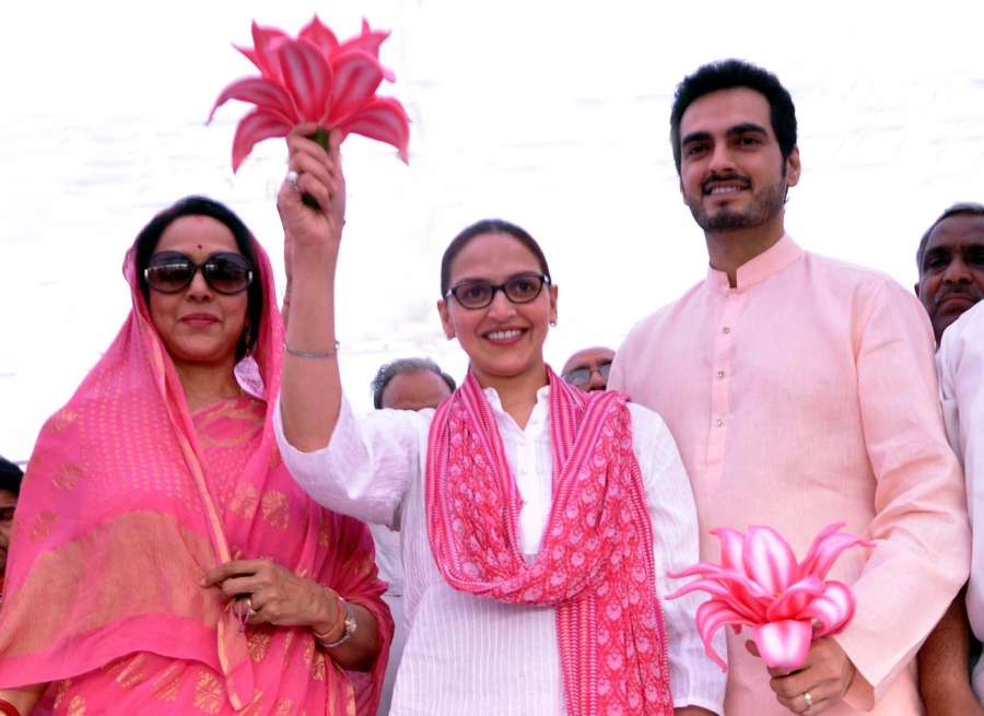 BJP candidate from Mathura, Hema Malini with her daughter actress Esha Deol and her husband Bharat Takhtani during campaigning for Lok Sabha election in Mathura on April 12, 2014. (Photo: IANS) by . 