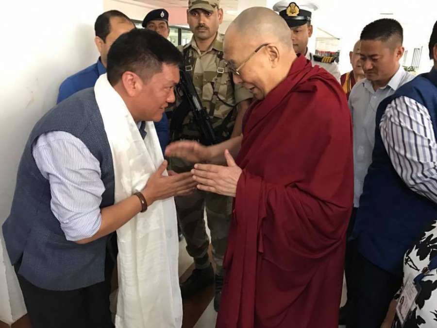 Guwahati: Arunachal Pradesh Chief Minister Pema Khandu welcomes Tibetan spiritual leader Dalai Lama on his arrival at Lokpriya Gopinath Bordoloi International Airport in Guwahati on April 1, 2017. (Photo: IANS) by . 