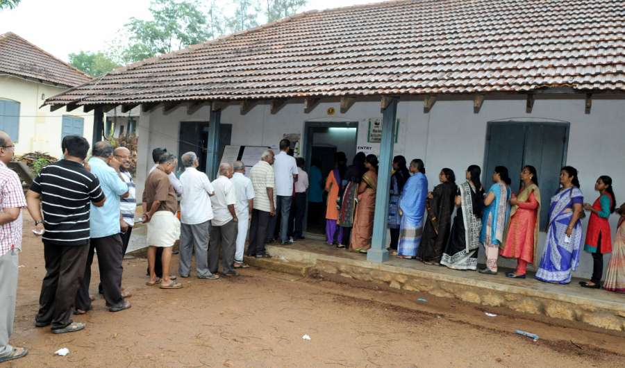 Trivandrum: Voters queue-up to cast their votes at a polling booth, during the Kerala Assembly Election, in Trivandrum district, Kerala on May 16, 2016. (Photo: IANS/PIB) by . 