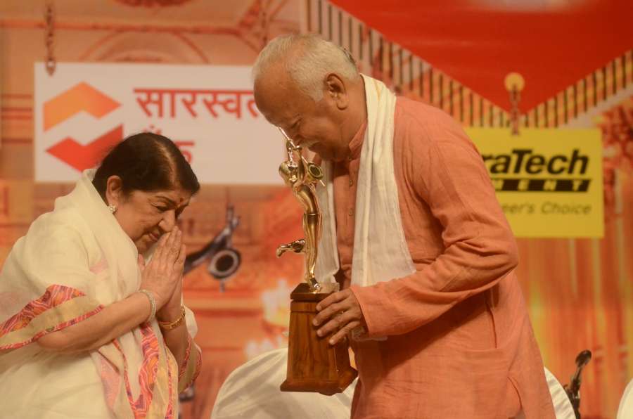 Mumbai: Singer Lata Mangeshkar being felicitated by RSS chief Mohan Bhagwat during Dinanath Mangeshkar memorial awards in Mumbai, on April 24, 2017. (Photo: IANS) by . 
