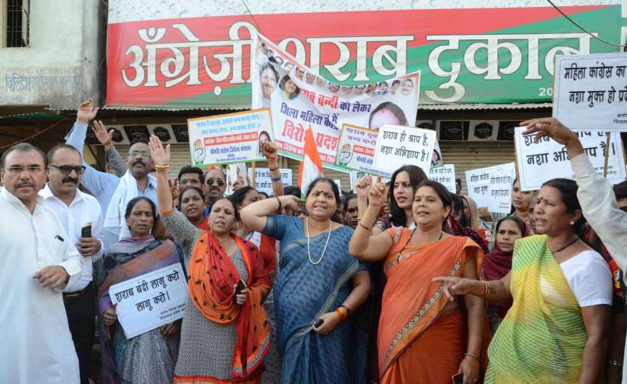 Bhopal: Congress workers stage a demonstration to press for shutting down liquor vends in residential areas of Bhopal on April 19, 2017. (Photo: IANS) by . 