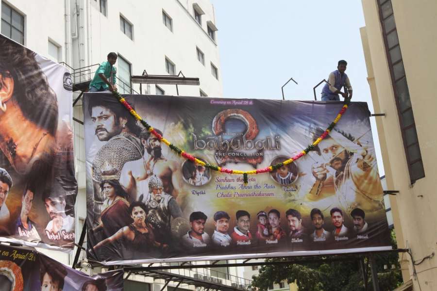 Mumbai: Fans wash a poster of "Baahubali 2" with milk after the film was released in Chennai, on April 28, 2017. (Photo: IANS) by .