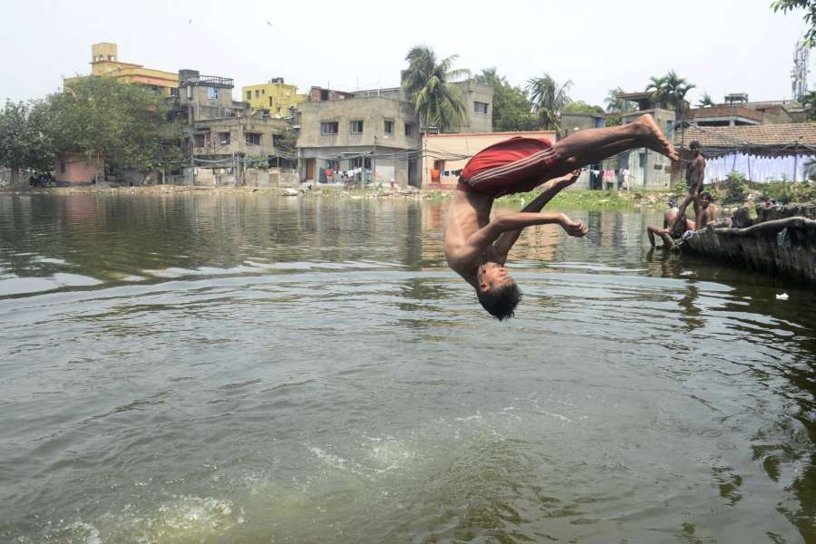 Kolkata: A boy plunges into a pond to beat the heat on a hot day in Kolkata on May 21, 2017. (Photo: Kuntal Chakrabarty/IANS) by . 