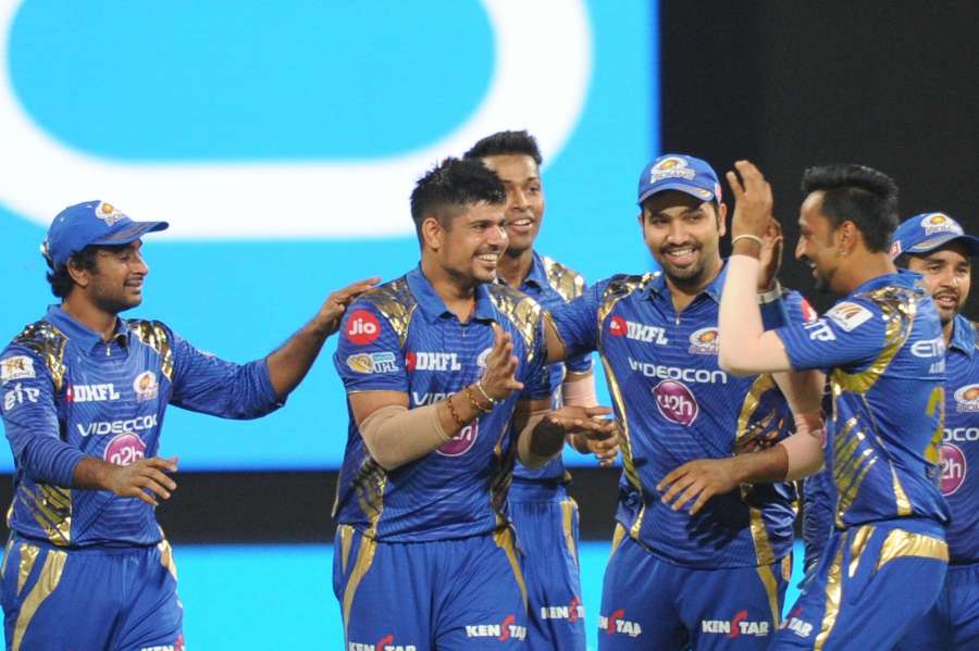Bengaluru: Mumbai Indians celebrate fall of a wicket during Qualifier 2 of IPL 2017 between Mumbai Indians and Kolkata Knight Riders at M Chinnaswamy Stadium in Bengaluru on May 19, 2017. (Photo: Dhananjay TK/IANS) by .