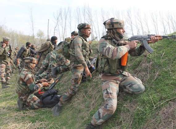 Pulwama: Security personnel during an encounter with militants in Pulwama district of Jammu and Kashmir on March 5, 2017. One policeman and two militants were killed in a gunfight that lasted over 15 hours. (Photo: IANS) by .