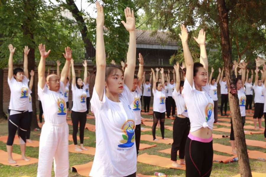 Beijing: People practice Yoga Asans -postures- on International Yoga Day in Beijing, China on June 21, 2017. (Photo: Gaurav Sharma/IANS) by . 