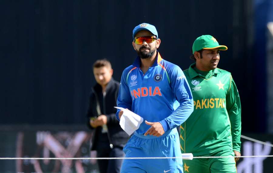 Birmingham: Indian captain Virat Kohli and his Pakistani Counterpart Sarfraz Ahmed during the toss for the ICC Champions Trophy, Group B match between India and Pakistan at Edgbaston, Birmingham, UK on June 4, 2017. (Photo: Bipin Patel/IANS) by . 