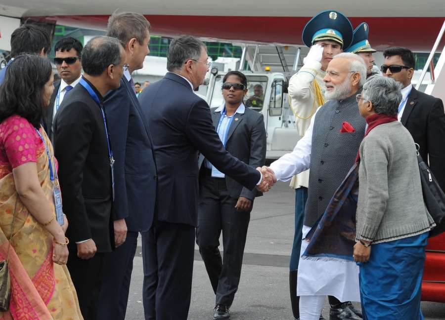 Astana: Prime Minister Narendra Modi being received on his arrival in Astana, Kazakhstan on June 8, 2017. (Photo: IANS/PIB) by . 