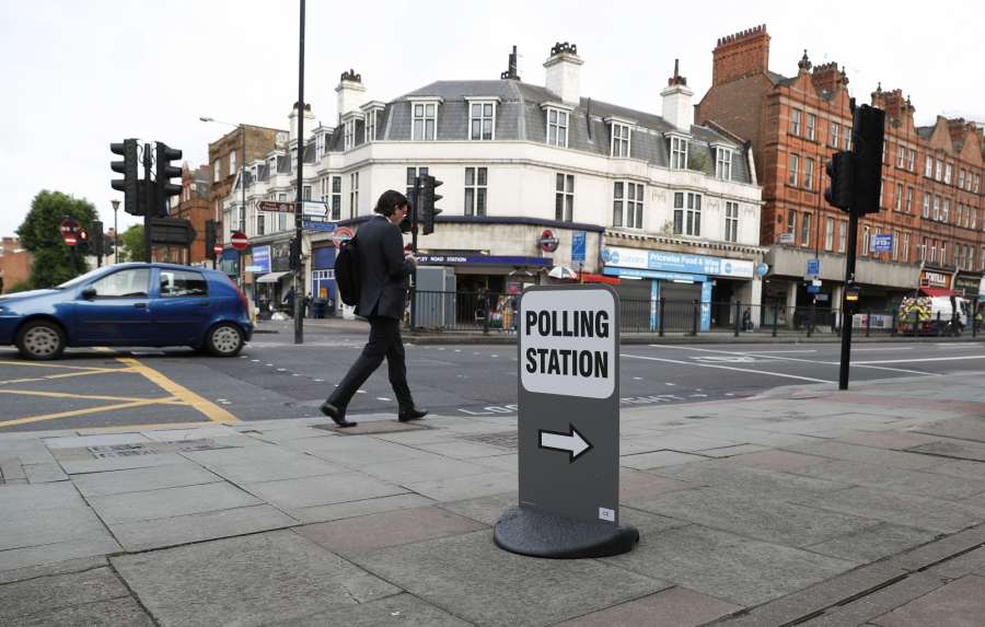 LONDON, June 8, 2017 (Xinhua) -- A man passes by a polling station in London, Britain, on June 8, 2017. Polling stations across the Britain opened early Thursday as voters started to make their decision in the general election. (Xinhua/Han Yan/IANS)(gj) by . 