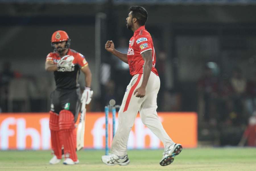 Indore: Varun Aaron of Kings XI Punjab celebrates fall of a wicket during an IPL 2017 match between Kings XI Punjab and Royal Challengers Bangalore at Holkar Cricket Stadium in Indore on April 10, 2017. (Photo: IANS) by . 