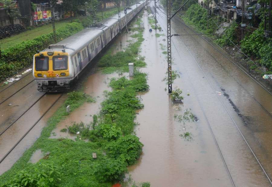 Mumbai: A view of submerged track as heavy rain hit train services in Mumbai on June 27, 2017. (Photo: IANS) by . 