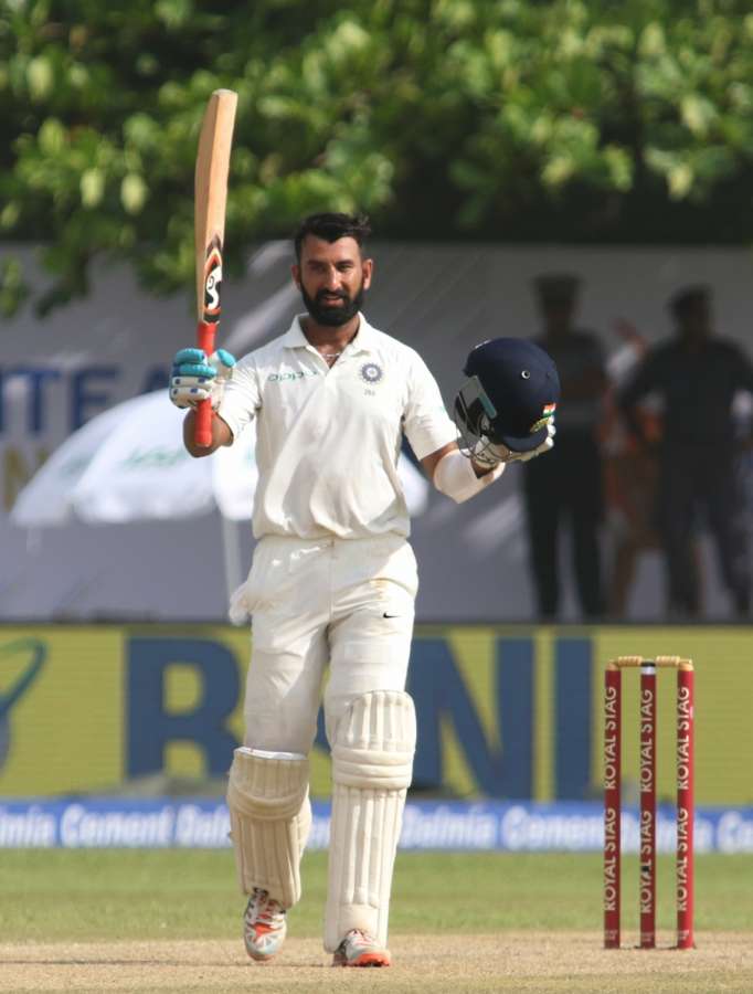 Galle (Sri Lanka): India's Cheteshwar Pujara celebrates his century on Day 1 of the first test match between India and Sri Lanka at Galle International Stadium in Galle, Sri Lanka on July 26, 2017. (Photo: Surjeet Yadav/IANS) by .
