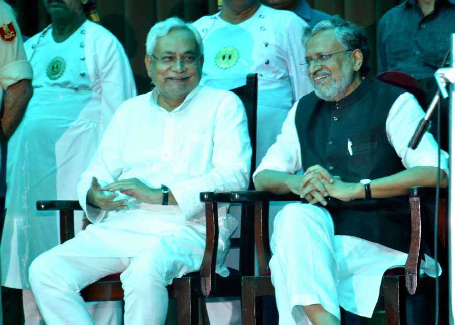 Patna: JD(U) leader Nitish Kumar and BJP leader Sushil Kumar Modi during the swearing in ceremony of Kumar as Chief Minister of Bihar at Raj Bhavan in Patna on July 27, 2017. (Photo: IANS) by .