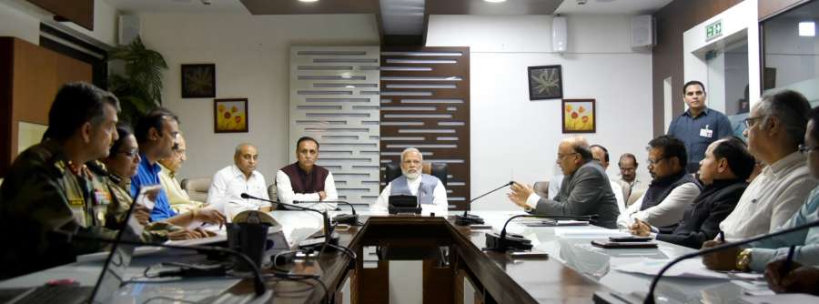 New Delhi: Prime Minister Narendra Modi takes a meeting on the situation arising out of incessant rain and floods in different parts of Gujarat in Ahmedabad on July 25, 2017. Also seen Gujarat Chief Minister Vijay Rupani and Gujarat Deputy Chief Minister Nitinbhai Patel. (Photo: IANS/PIB) by .