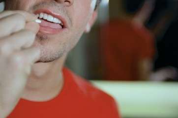 Man taking recreational drugs by .
