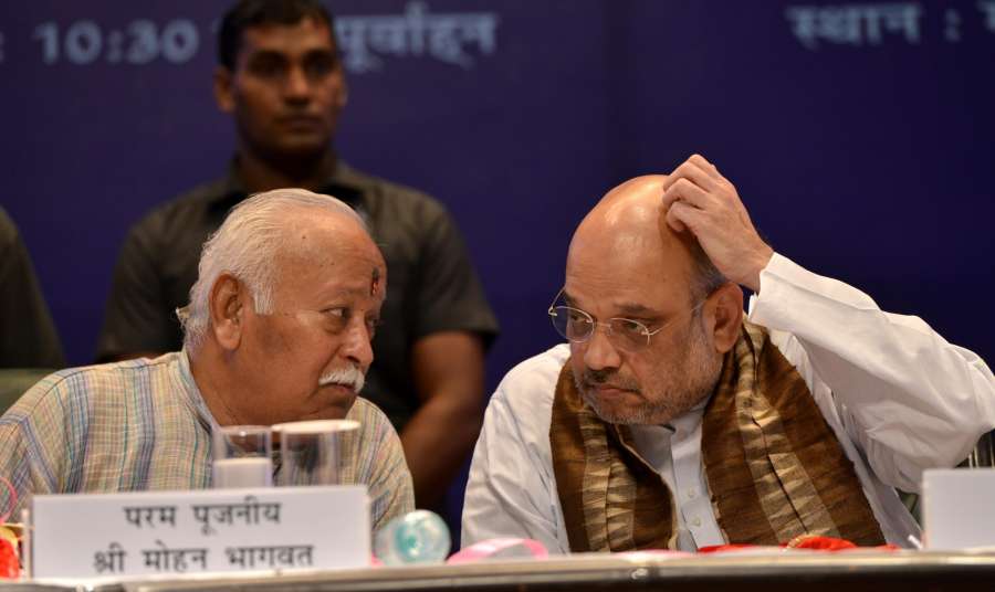 New Delhi: RSS Chief Mohan Bhagwat and BJP chief Amit Shah at the lunch of "The making of a Legend" - a book on Prime Minister Narendra Modi written by and Sulabh International founder Bindeshwar Pathak in New Delhi on July 12, 2017. (Photo: IANS) by . 