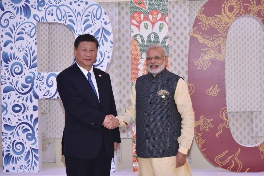 Goa: Prime Minister Narendra Modi formally welcomes the Chinese President Xi Jinping to the BRICS Summit venue, in Goa on Oct 16, 2016. (Photo: IANS/PIB) by . 
