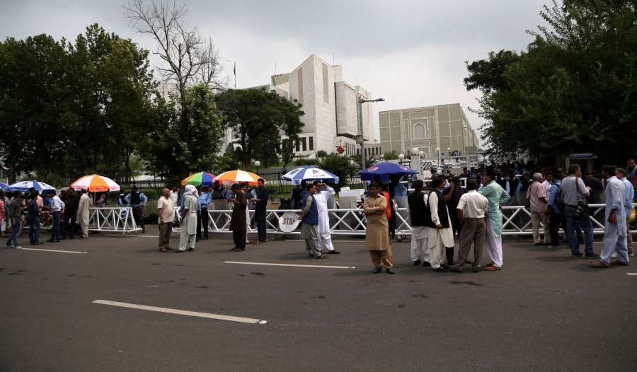 ISLAMABAD, July 28, 2017 (Xinhua) -- Pakistani people stand outside the Supreme Court waiting for its verdict over corruption charges against Prime Minister Nawaz Sharif, in Islamabad, capital of Pakistan, July 28, 2017. Pakistan's Supreme Court on Friday by .