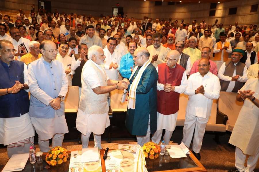 New Delhi: Prime Minister Narendra Modi felicitates BJP president Amit Shah who completed his three years as BJP president and has been elected to the Rajya Sabha during BJP parliamentary meeting in New Delhi on Aug 10, 2017. (Photo: IANS) by .